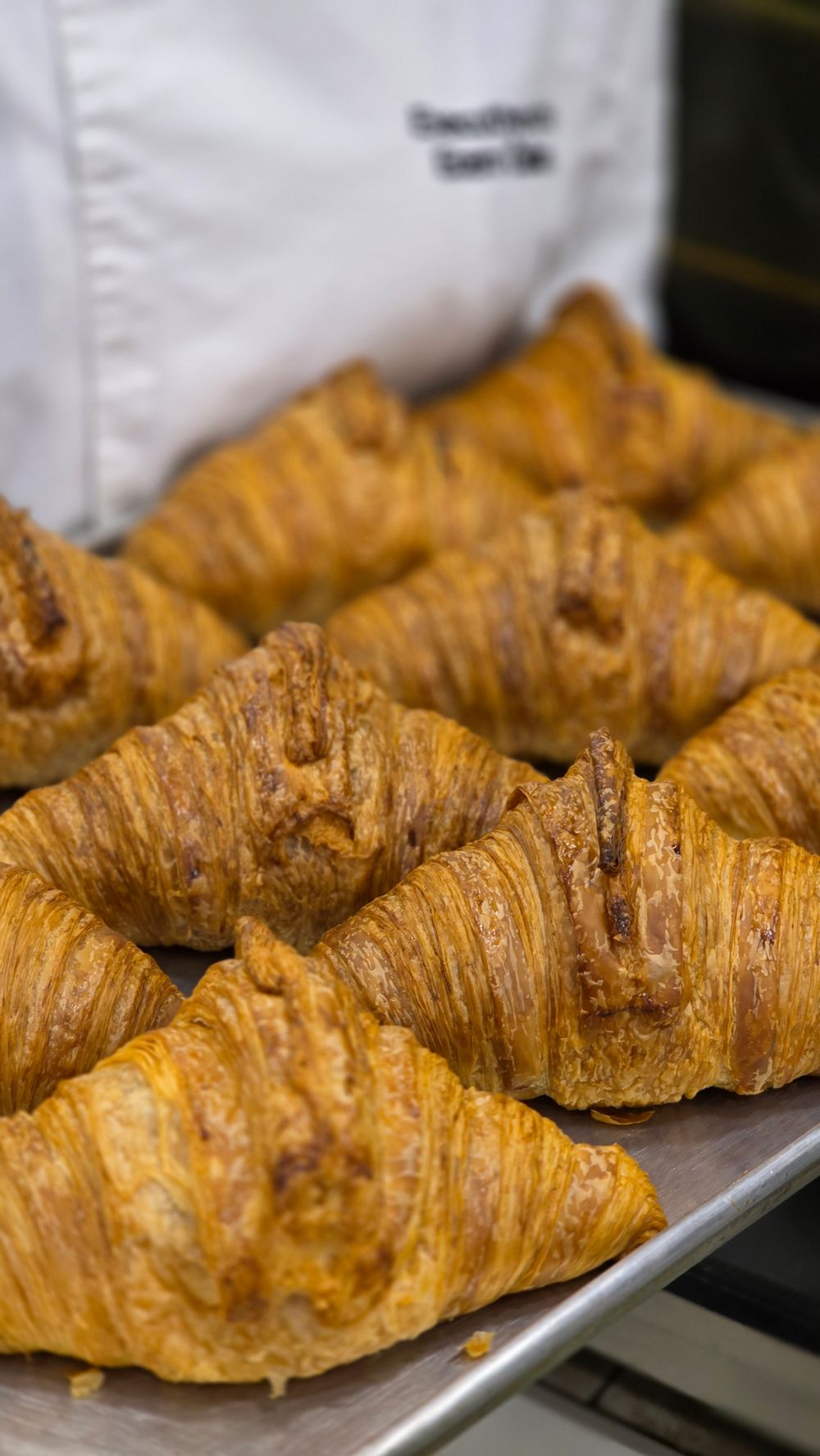 Golden croissants on a tray